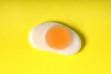 jelly candy fried egg over yellow background