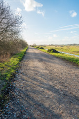 Country road covered with rubble in a Dutch polder