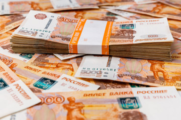 Stack of banknotes, many banknotes of five thousand Russian rubles as a background, packed stack of banknotes 5000 rubles, five hundred thousand