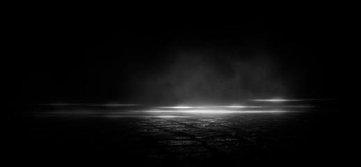 Wet asphalt, reflection of neon lights, a searchlight, smoke. Abstract light in a dark empty street with smoke, smog. Dark background scene of empty street, night view, night city.