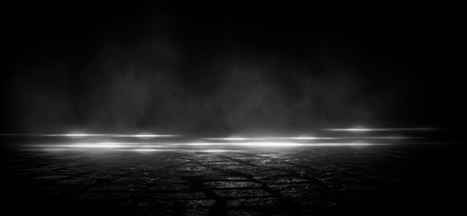 Wet asphalt, reflection of neon lights, a searchlight, smoke. Abstract light in a dark empty street with smoke, smog. Dark background scene of empty street, night view, night city.
