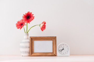 White landscape frame mock up with a vase of gerbera beside the frame, overlay your quote, promotion, headline, or design, great for small businesses, lifestyle bloggers and social media campaigns