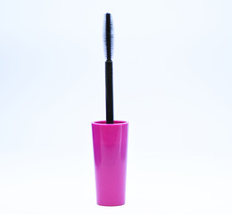 Black mascara brush white background. Beauty concept. Brush for applying mascara on eyelashes. Makeup beauty product. Mascara add volume and length to natural eyelashes. Mascara plastic brush