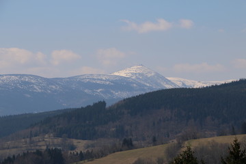 Rudawy Janowickie Mountains during spring. Karkonosze Mountains, Śnieżka Mountain (snow-covered)...