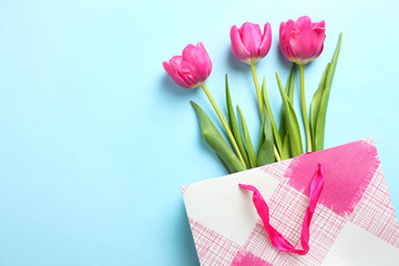 bouquet of pink tulips in pink bag