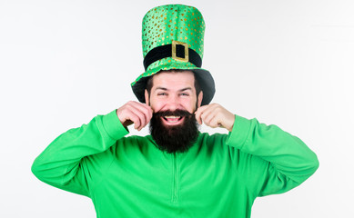 Happy saint patricks day. Hipster in leprechaun hat and costume twirling moustache. Getting the...