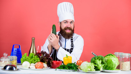 vegetable salad. Bearded man cook in kitchen, culinary. Healthy food cooking. Dieting and organic food, vitamin. Vegetarian. Mature chef with beard. Chef man in hat. Secret taste recipe