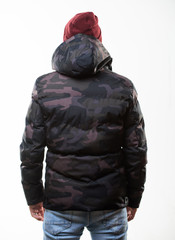 Comfortable winter outfit. Winter stylish menswear. Man stand warm camouflage pattern jacket parka with hood isolated on white background. Hipster winter fashion. Guy wear hat and black winter jacket © be free
