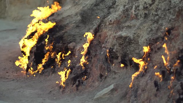 Natural burning ground. Burning natural gas from underground.