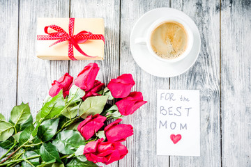Mother's day greeting background concept, with red rose flowers, greeting card creative pancakes for best mom, i love mom, and coffee mug, wooden background copy space