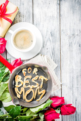 Mother's day greeting background concept, with red rose flowers, greeting card creative pancakes for best mom, i love mom, and coffee mug, wooden background copy space