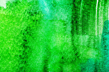Top view of green watercolor brushstrokes with copy space