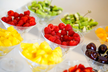 Delicious fruits in glasses