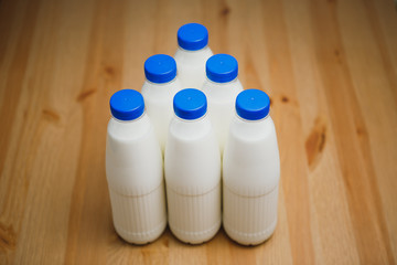 milk bottles on wooden table