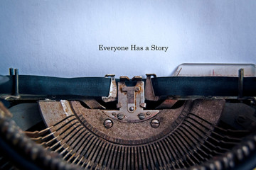 In the old typewriter inserted a white sheet of paper with the inscription: Everyone Has a Story