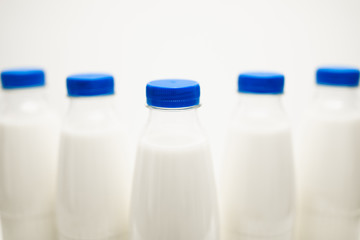 milk bottles on white table