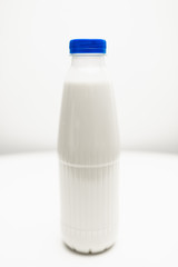 milk bottles on white table