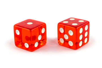 Two red glass game dice very close up isolated on white background. One and four with a shadow.