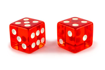 Two red glass game dice very close up isolated on white background. Five and four with a shadow.