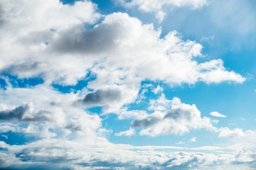 Blue Sky with White Clouds Illuminated by the Sun