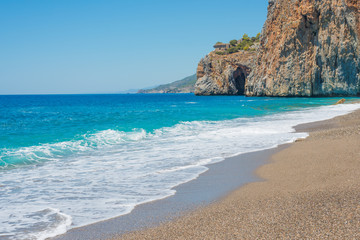 Beautiful seascape with sea wash and a rock (Turkey, Gazipasha, Mediterranean sea).