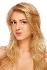 Naklejka premium Young beautiful girl with long curly hair and clean make-up