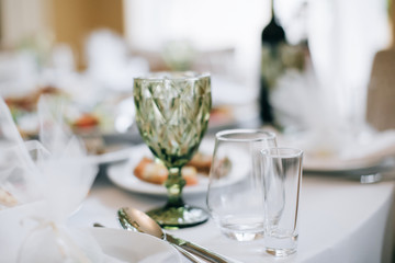 glass of wine and flowers on table