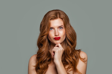 Red head woman thinking. Doubt and choice concept. Expressive facial expressions