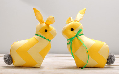 Two Easter bunnies and empty space for text. Easter holiday concept.
