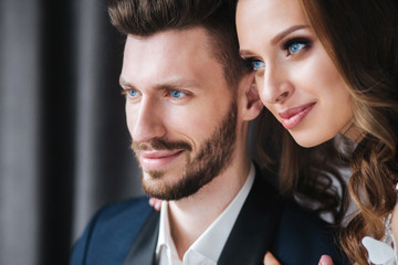 Wedding couple hugging each other indoor.Close-up portrait of wedding couple . Beauty bride with groom.