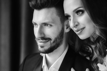 Wedding couple hugging each other indoor.Close-up portrait of wedding couple . Beauty bride with groom.