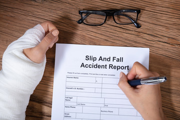 Woman Hand Filling The Slip And Fall Injury Report