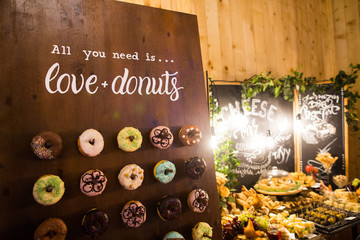 Delicious donuts on wooden stander