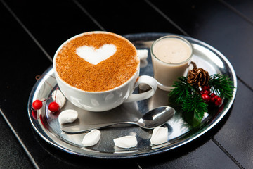 cup of coffee and cookies on a wooden table