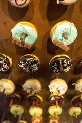 Delicious donuts on wooden stander