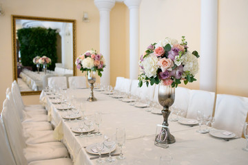 Beautiful flowers composition on table in wedding day
