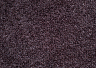 Seamless texture of knitted wool fabric in brown color