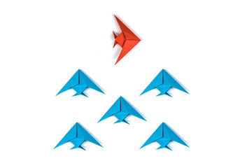 Paper origami fishes isolated on white background.