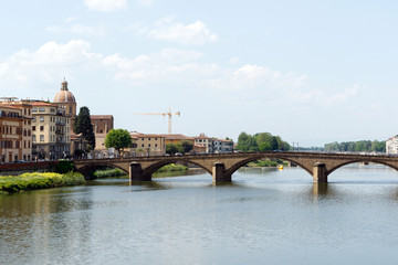 Obraz premium Bridge across the Arno River, Florence, Italy with palazzos lining the bank
