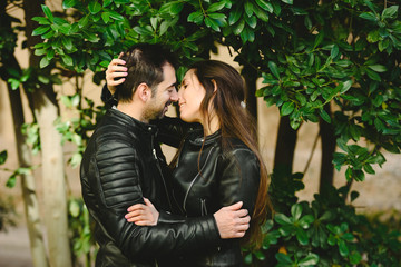 Head shot portrait of a couple in love, holding each other and demonstrating their free love.