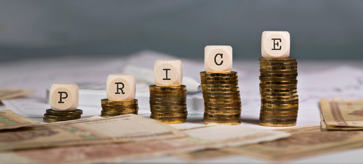 Word PRICE composed of wooden letter.