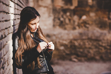 Serious and doubtful young woman with unsure face, feeling uncertain considering making decision,...
