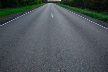 Fototapeta premium Empty straight road at sunrise