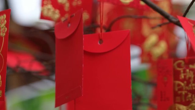 Lucky red envelope in Vietnamese Tet holiday for  lucky, successful, make a lot of money. High-quality stock footage of red envelopes Lunar New Year calligraphy decorated. Culture of Vietnamese Tet