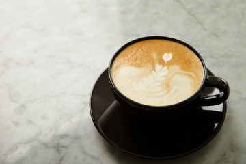 Latte art, black coffee cup