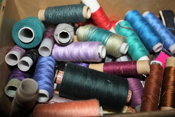 Closeup Group of colorful spools of thread use to sewing, needlework and embroidery