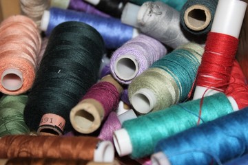 Closeup Group of colorful spools of thread use to sewing, needlework and embroidery