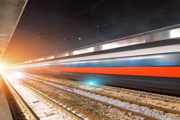 Obraz premium Passing on the high speed train station by night