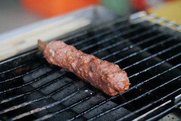 Grilling a Meat in Barbecue