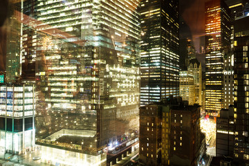 Fototapeta na wymiar Illuminated Corporate Buildings At Night